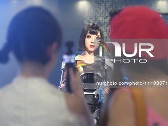 An intelligent bionic ''beauty'' robot is performing and interacting with citizens to answer questions at a shopping mall in Hangzhou, China...