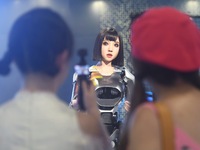 An intelligent bionic ''beauty'' robot is performing and interacting with citizens to answer questions at a shopping mall in Hangzhou, China...