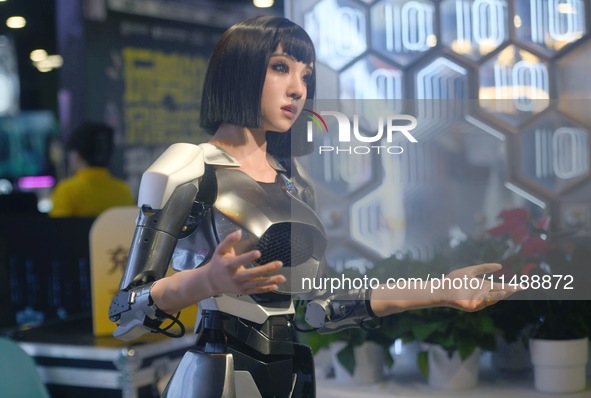 HANGZHOU, CHINA - AUGUST 17, 2024 - An intelligent bionic ''beauty'' robot performs and interacts with citizens to answer questions at a sho...