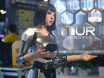 HANGZHOU, CHINA - AUGUST 17, 2024 - An intelligent bionic ''beauty'' robot performs and interacts with citizens to answer questions at a sho...