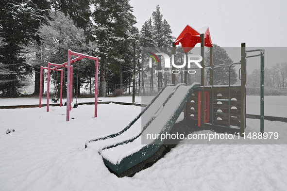 A snow-covered playground is being seen during heavy snowfall in Springfield, in the Selwyn District of Canterbury, in the South Island, New...