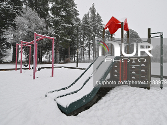 A snow-covered playground is being seen during heavy snowfall in Springfield, in the Selwyn District of Canterbury, in the South Island, New...