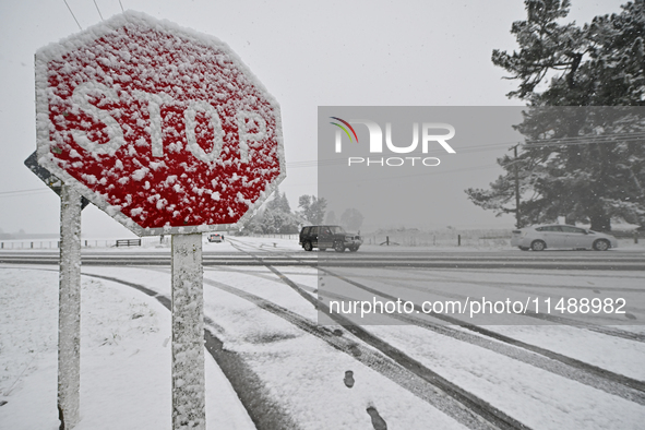 A snow-covered road and a railway track are being seen during heavy snowfall in Springfield, in the Selwyn District of Canterbury, in the So...