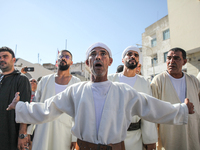 Devotees from a Sufi order are dancing and chanting spiritual songs during the annual procession of Sidi Bou Said in Ariana, Tunisia, on Aug...