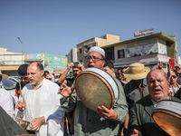 Devotees from a Sufi order are dancing and chanting spiritual songs during the annual procession of Sidi Bou Said in Ariana, Tunisia, on Aug...