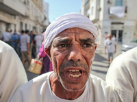 Devotees from a Sufi order are dancing and chanting spiritual songs during the annual procession of Sidi Bou Said in Ariana, Tunisia, on Aug...