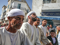 Devotees from a Sufi order are dancing and chanting spiritual songs during the annual procession of Sidi Bou Said in Ariana, Tunisia, on Aug...