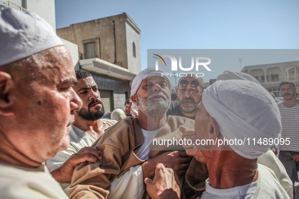 A devotee from a Sufi order is entering a state of trance during the annual procession of Sidi Bou Said in Ariana, Tunisia, on August 11, 20...