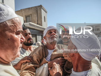 A devotee from a Sufi order is entering a state of trance during the annual procession of Sidi Bou Said in Ariana, Tunisia, on August 11, 20...