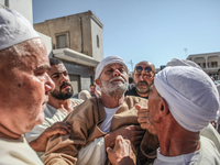 A devotee from a Sufi order is entering a state of trance during the annual procession of Sidi Bou Said in Ariana, Tunisia, on August 11, 20...