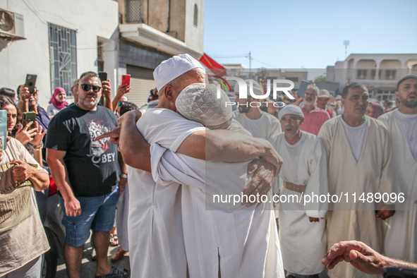 A devotee from a Sufi order is entering a state of trance during the annual procession of Sidi Bou Said in Ariana, Tunisia, on August 11, 20...