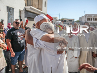 A devotee from a Sufi order is entering a state of trance during the annual procession of Sidi Bou Said in Ariana, Tunisia, on August 11, 20...