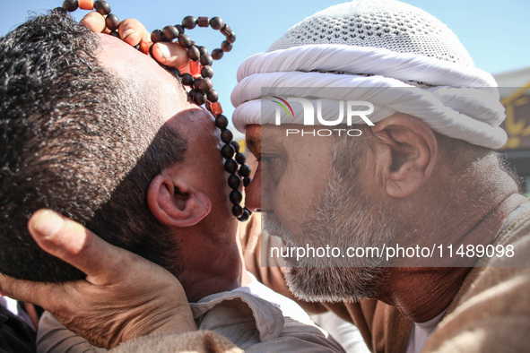 A devotee from a Sufi order is entering a state of trance during the annual procession of Sidi Bou Said in Ariana, Tunisia, on August 11, 20...