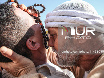 A devotee from a Sufi order is entering a state of trance during the annual procession of Sidi Bou Said in Ariana, Tunisia, on August 11, 20...