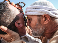 A devotee from a Sufi order is entering a state of trance during the annual procession of Sidi Bou Said in Ariana, Tunisia, on August 11, 20...