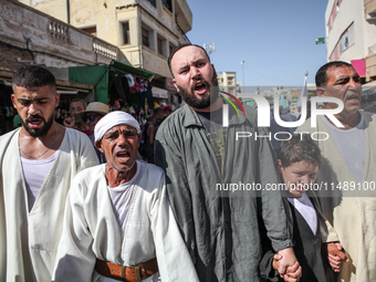 Devotees from a Sufi order are dancing and chanting spiritual songs during the annual procession of Sidi Bou Said in Ariana, Tunisia, on Aug...