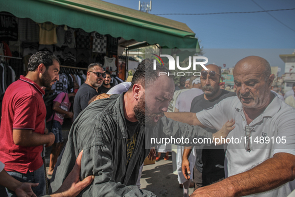 A devotee from a Sufi order is entering a state of trance during the annual procession of Sidi Bou Said in Ariana, Tunisia, on August 11, 20...