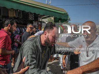 A devotee from a Sufi order is entering a state of trance during the annual procession of Sidi Bou Said in Ariana, Tunisia, on August 11, 20...