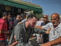 A devotee from a Sufi order is entering a state of trance during the annual procession of Sidi Bou Said in Ariana, Tunisia, on August 11, 20...