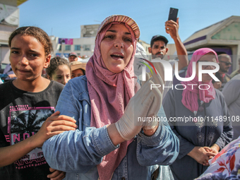 Women are chanting spiritual songs as they are attending the procession of Sidi Bou Said in Ariana, Tunisia, on August 11, 2024. The annual...