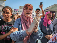 Women are chanting spiritual songs as they are attending the procession of Sidi Bou Said in Ariana, Tunisia, on August 11, 2024. The annual...