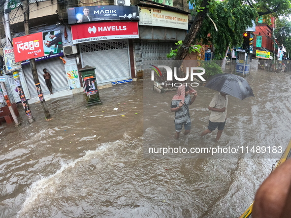 A street is flooding during the heavy monsoon rain in Kolkata, India, on August 18, 2024. 