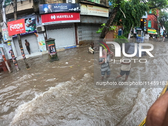 A street is flooding during the heavy monsoon rain in Kolkata, India, on August 18, 2024. (