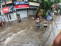 A street is flooding during the heavy monsoon rain in Kolkata, India, on August 18, 2024. (