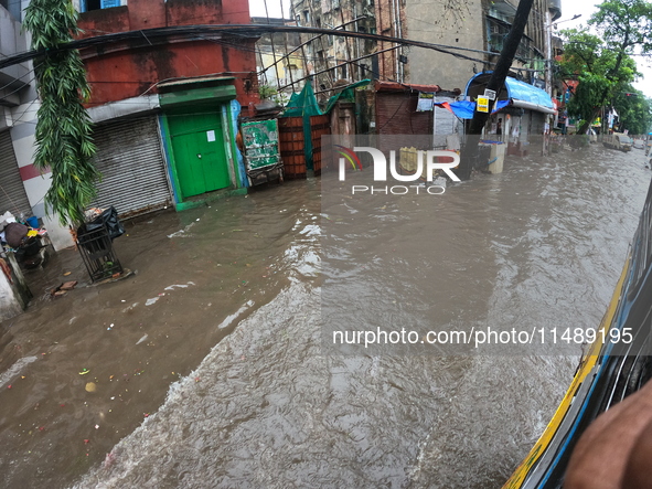 A street is flooding during the heavy monsoon rain in Kolkata, India, on August 18, 2024. 