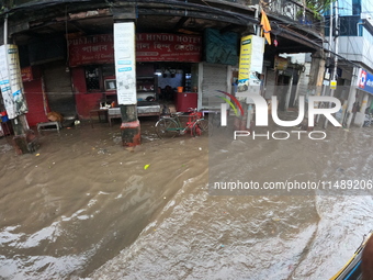 A street is flooding during the heavy monsoon rain in Kolkata, India, on August 18, 2024. (