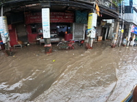 A street is flooding during the heavy monsoon rain in Kolkata, India, on August 18, 2024. (