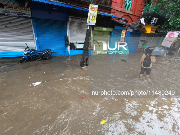 A street is flooding during the heavy monsoon rain in Kolkata, India, on August 18, 2024. 