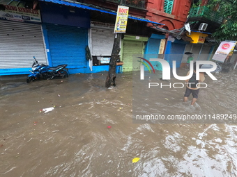 A street is flooding during the heavy monsoon rain in Kolkata, India, on August 18, 2024. (