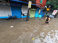 A street is flooding during the heavy monsoon rain in Kolkata, India, on August 18, 2024. (