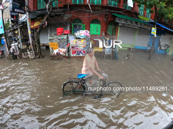 A street is flooding during the heavy monsoon rain in Kolkata, India, on August 18, 2024. 