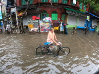 A street is flooding during the heavy monsoon rain in Kolkata, India, on August 18, 2024. (