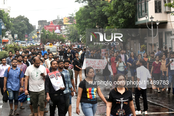 Doctors are marching on the street during a protest condemning the rape and murder of a trainee medic at a government-run hospital, in Kolka...