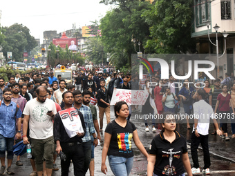 Doctors are marching on the street during a protest condemning the rape and murder of a trainee medic at a government-run hospital, in Kolka...