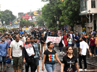 Doctors are marching on the street during a protest condemning the rape and murder of a trainee medic at a government-run hospital, in Kolka...