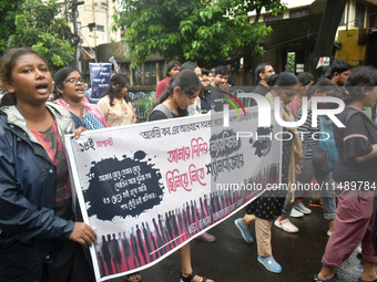 Doctors are marching on the street during a protest condemning the rape and murder of a trainee medic at a government-run hospital, in Kolka...