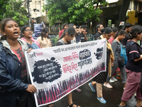 Doctors are marching on the street during a protest condemning the rape and murder of a trainee medic at a government-run hospital, in Kolka...