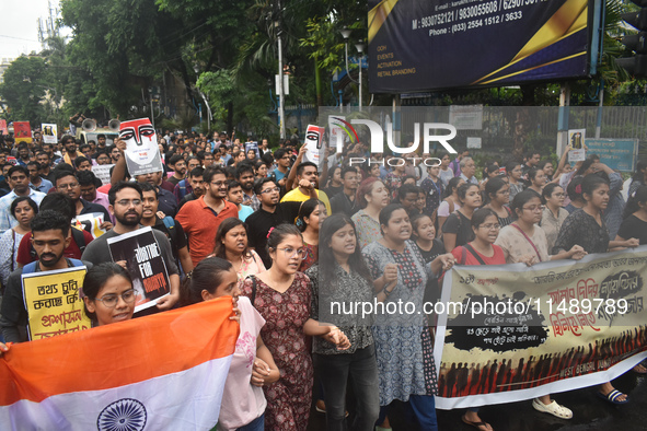 Doctors are marching on the street during a protest condemning the rape and murder of a trainee medic at a government-run hospital, in Kolka...