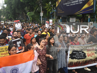 Doctors are marching on the street during a protest condemning the rape and murder of a trainee medic at a government-run hospital, in Kolka...