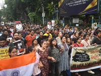 Doctors are marching on the street during a protest condemning the rape and murder of a trainee medic at a government-run hospital, in Kolka...