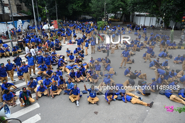 Members of the Gram Police Bahini are blocking the Kakrail intersection in Dhaka, Bangladesh, on August 18, 2024, to protest and demand the...