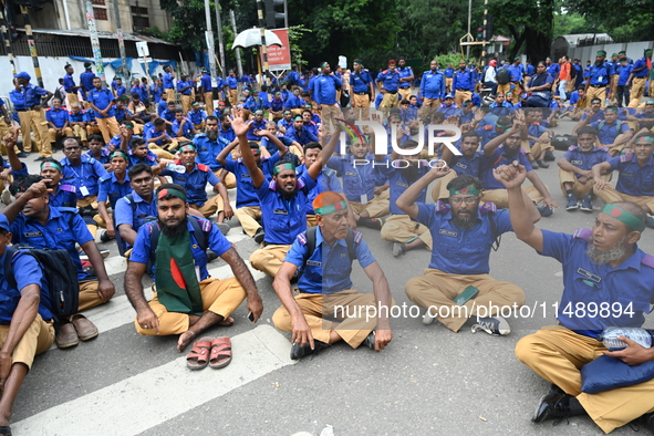 Members of the Gram Police Bahini are blocking the Kakrail intersection in Dhaka, Bangladesh, on August 18, 2024, to protest and demand the...