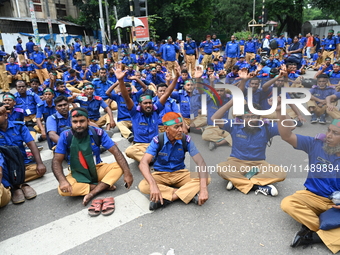 Members of the Gram Police Bahini are blocking the Kakrail intersection in Dhaka, Bangladesh, on August 18, 2024, to protest and demand the...