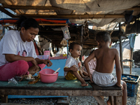 A small shop is operating in a slum settlement in Jakarta, Indonesia, on August 18, 2024. (