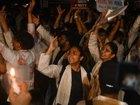 Medical professionals and students are shouting slogans in a protest demanding justice following the rape and murder of a trainee medic at a...