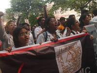 Medical professionals and students are holding placards and shouting slogans in a protest march demanding justice following the rape and mur...